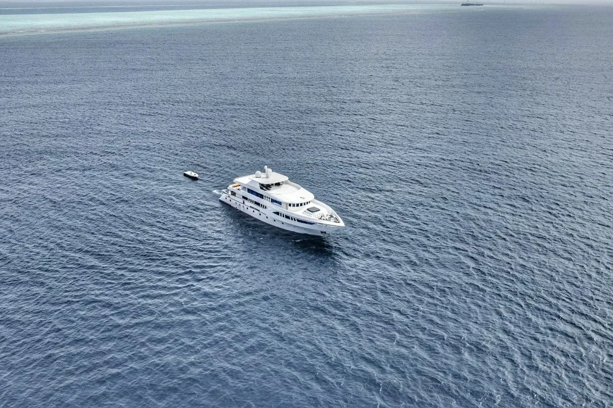 Aerial view of Spirit of Maldives in a turquoise lagoon
