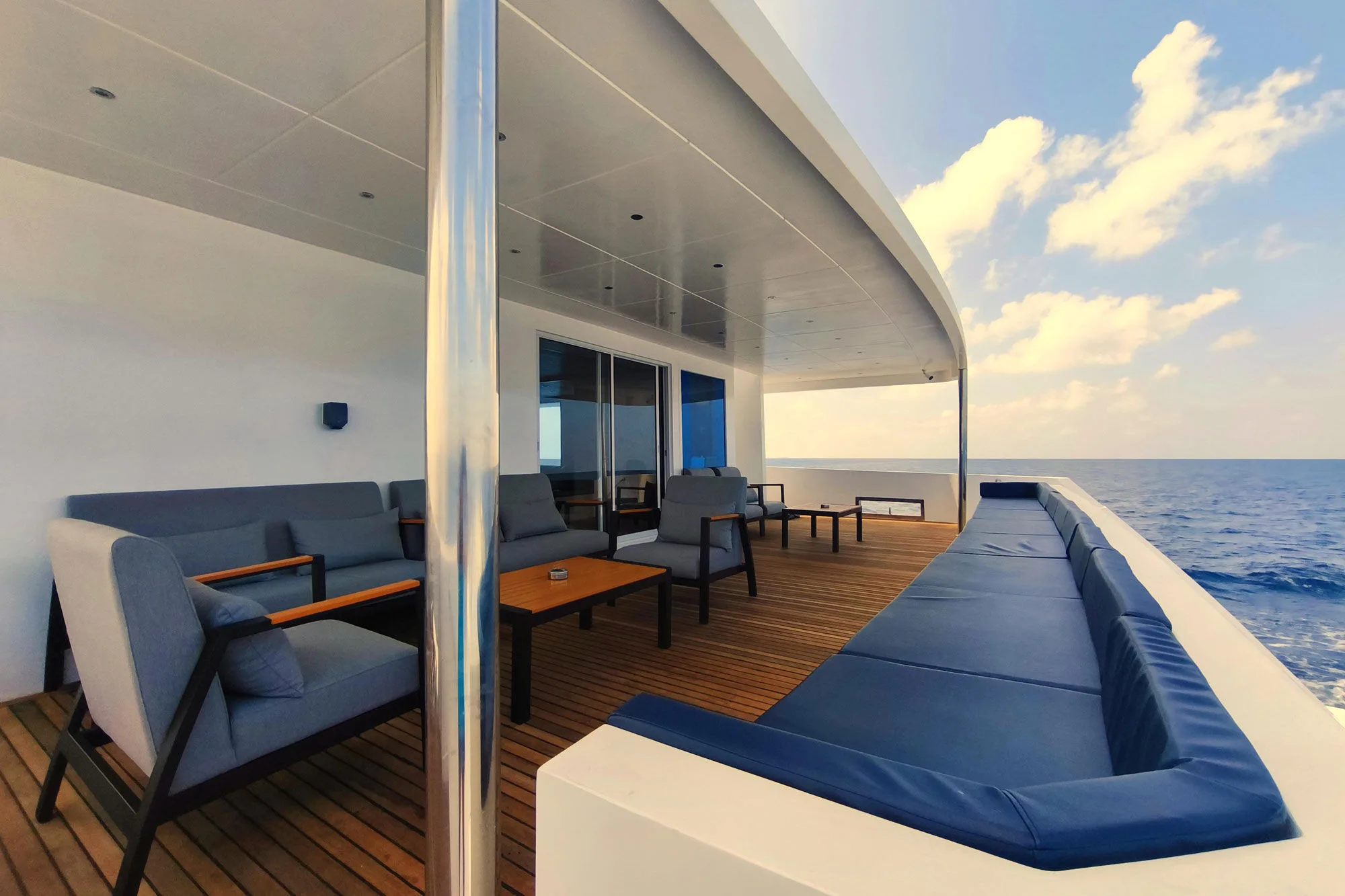 Teak main deck stern of Spirit of Maldives with sofas