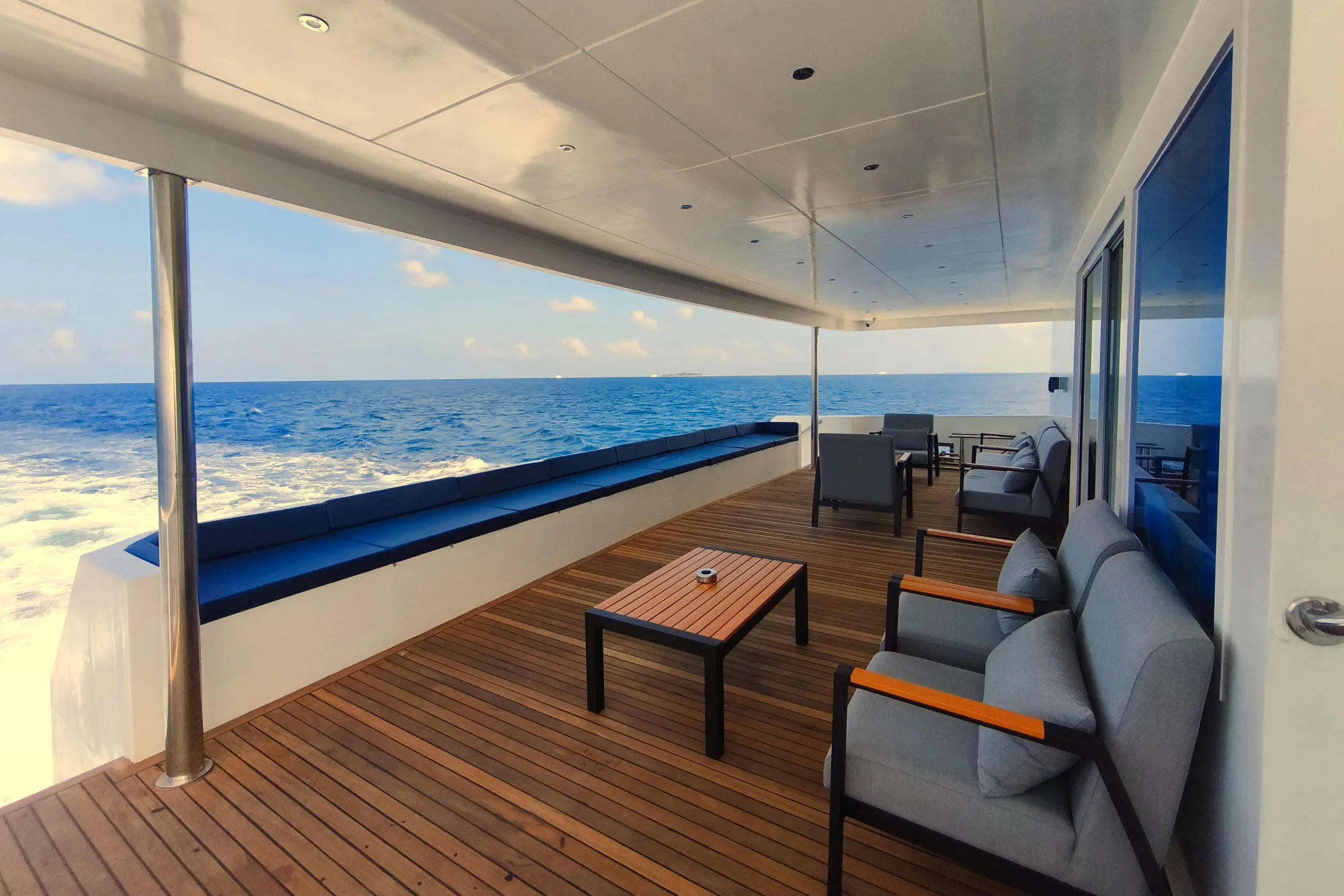 Open deck of Spirit of Maldives overlooking the wake