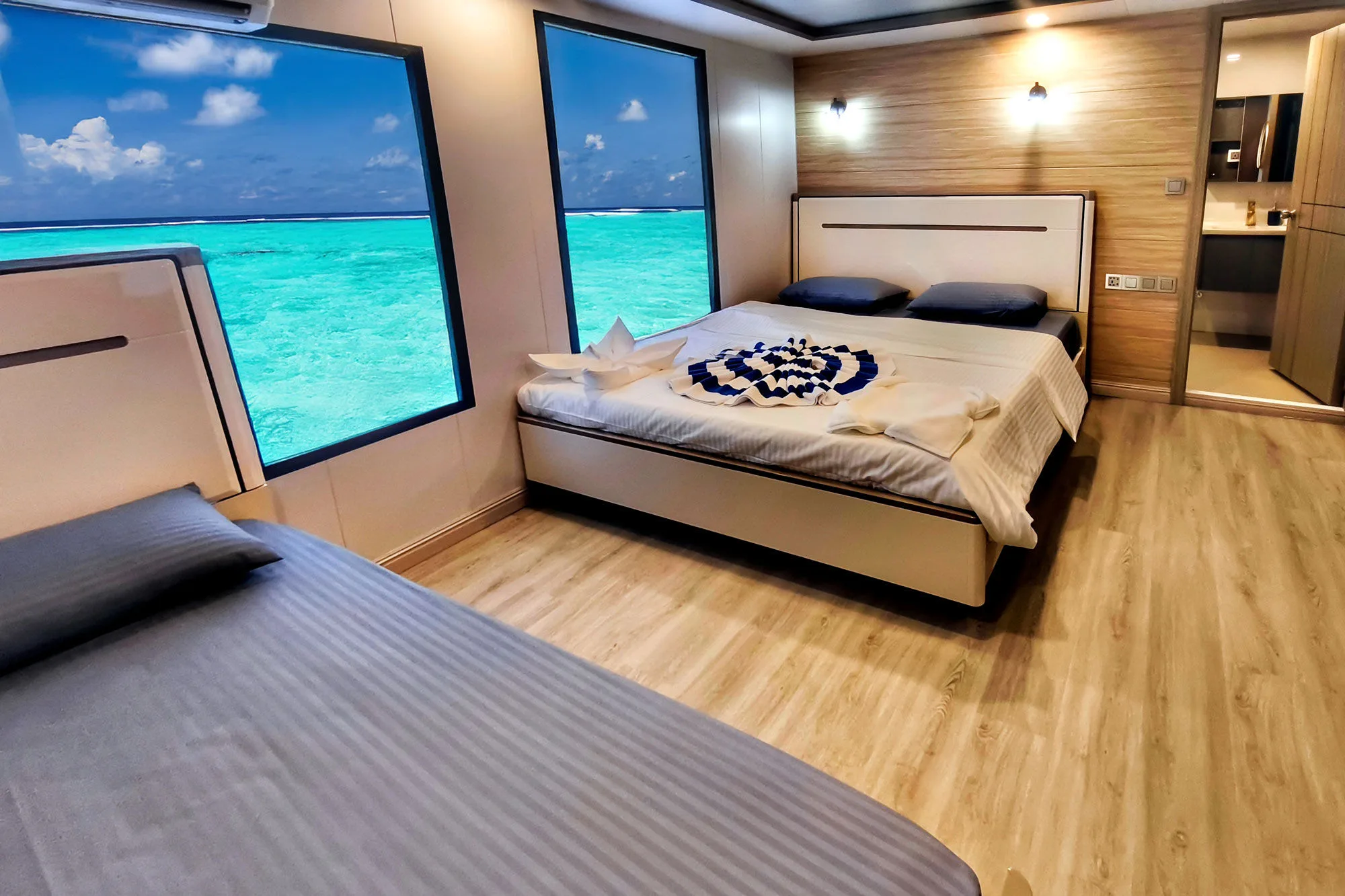 Upper deck standard cabin on Spirit of Maldives with a lagoon view