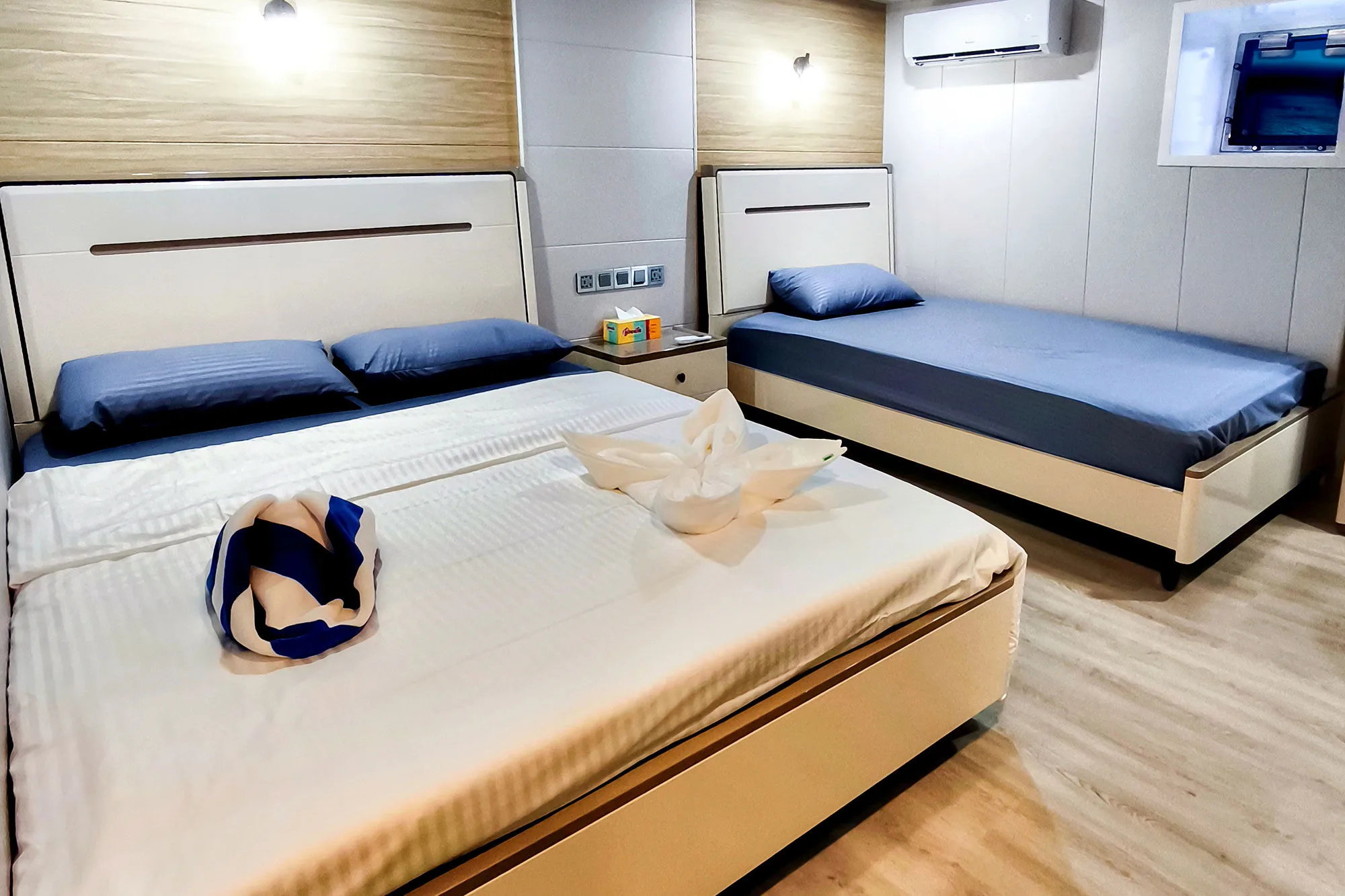 Lower deck standard cabin on Spirit of Maldives — double and single beds