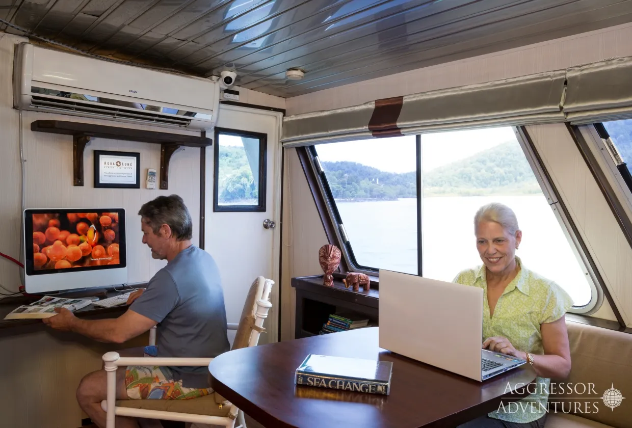 Salon of Thailand Aggressor with a work corner and a sea view