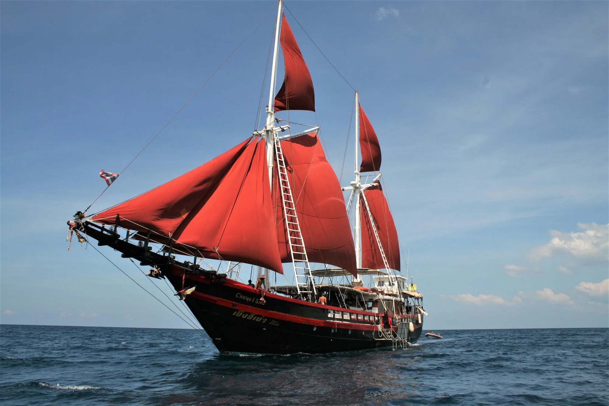 The phinisi Thailand Master sailing under full canvas in the open Andaman Sea