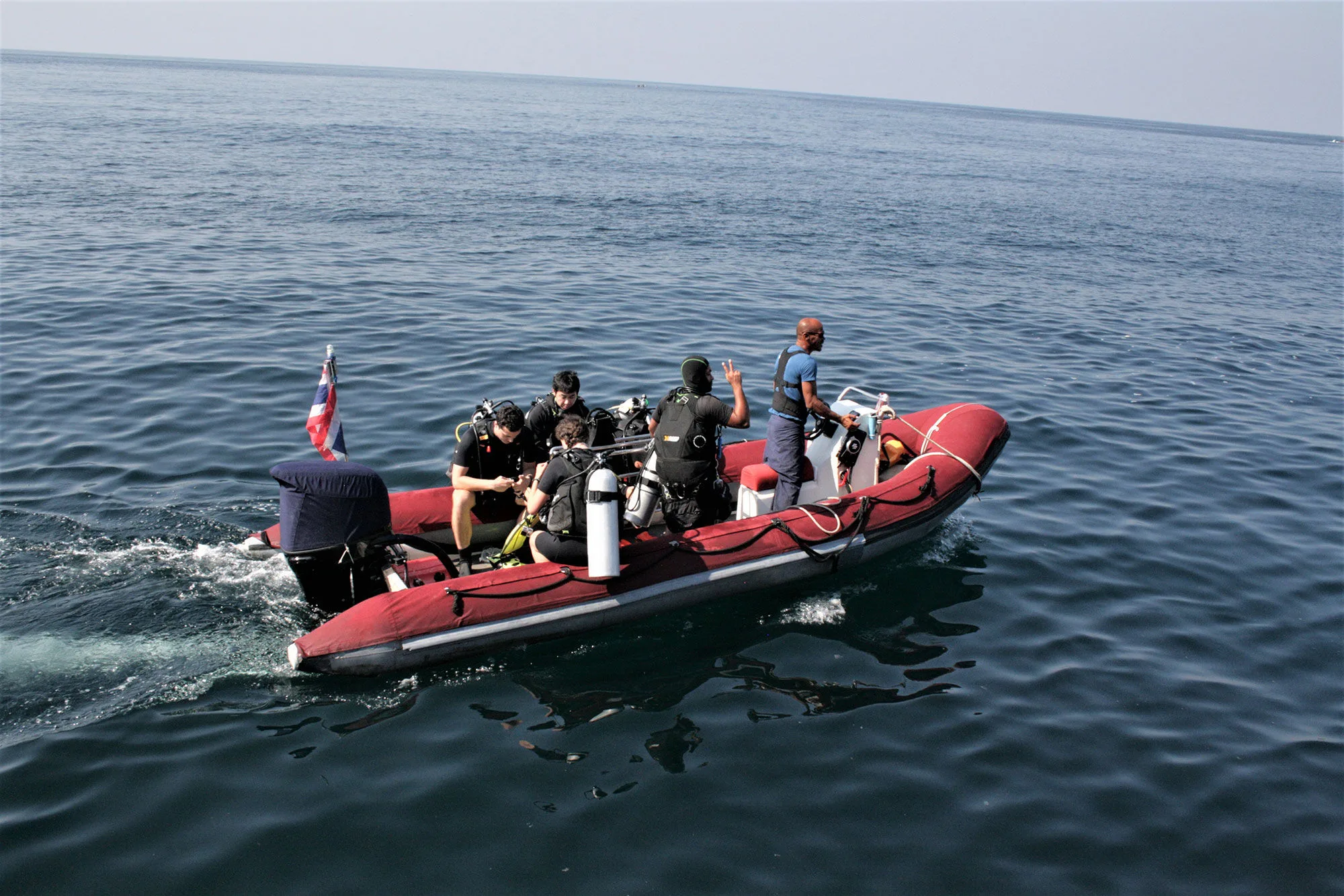 A motor tender from Thailand Master running divers out to a dive site