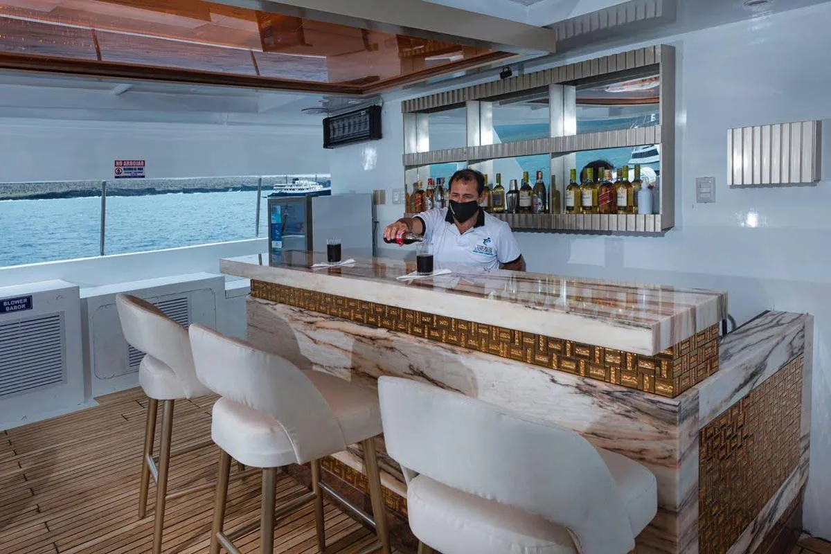 Bartender at the upper deck bar of Tiburon Explorer