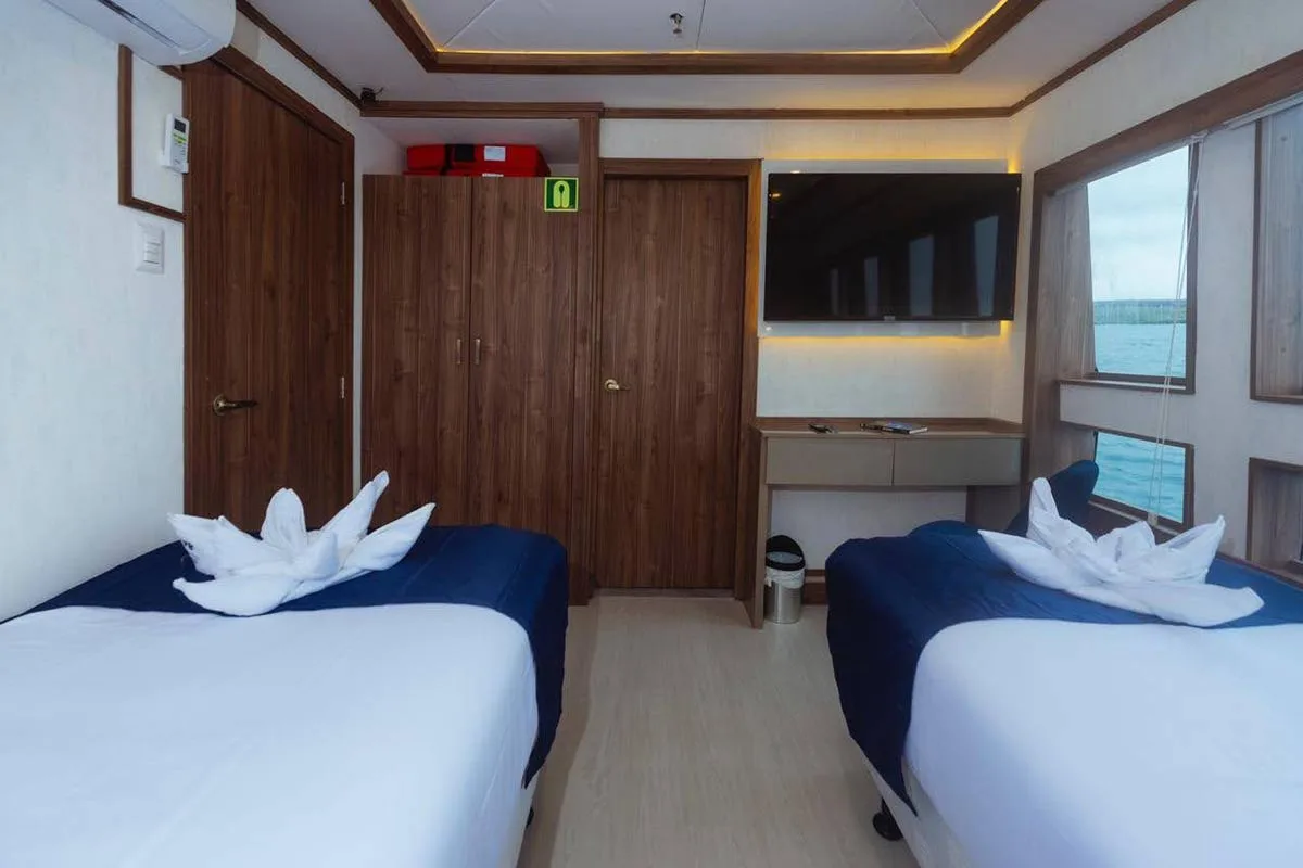 Main deck cabin on Tiburon Explorer with wardrobes and desk