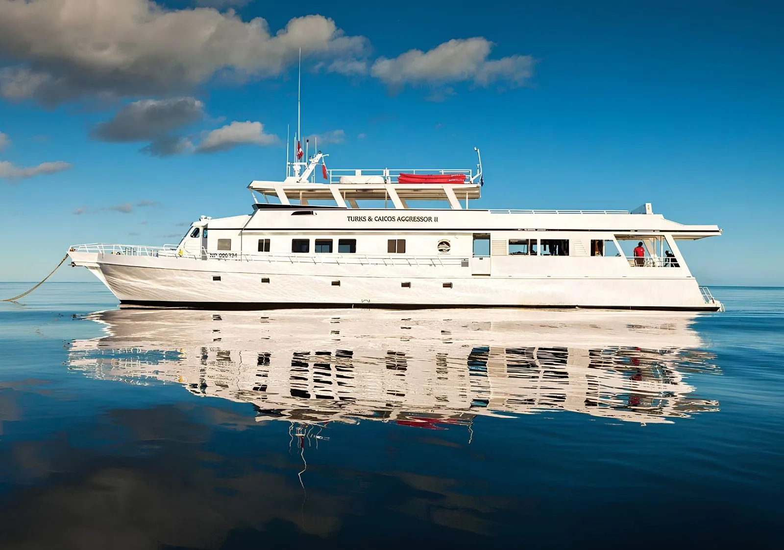 Turks and Caicos Aggressor II mirrored in glassy water