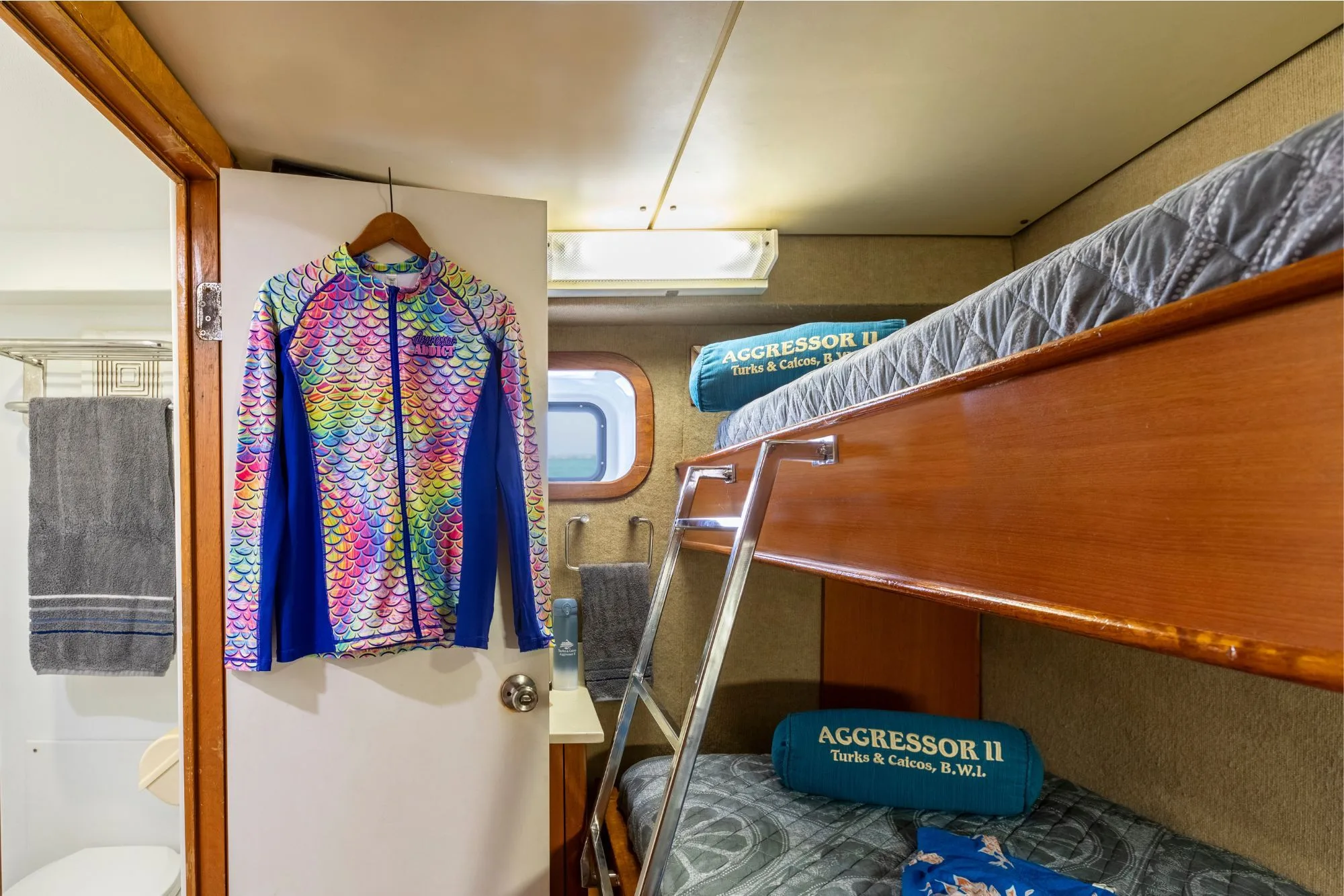 Deluxe stateroom bunks and bathroom door on Turks and Caicos Aggressor II