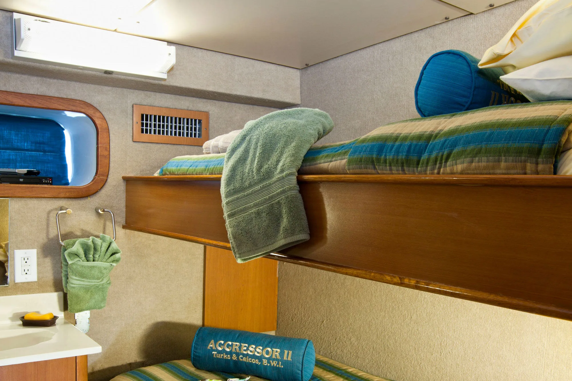 Twin share stateroom on Turks and Caicos Aggressor II with two single berths stacked
