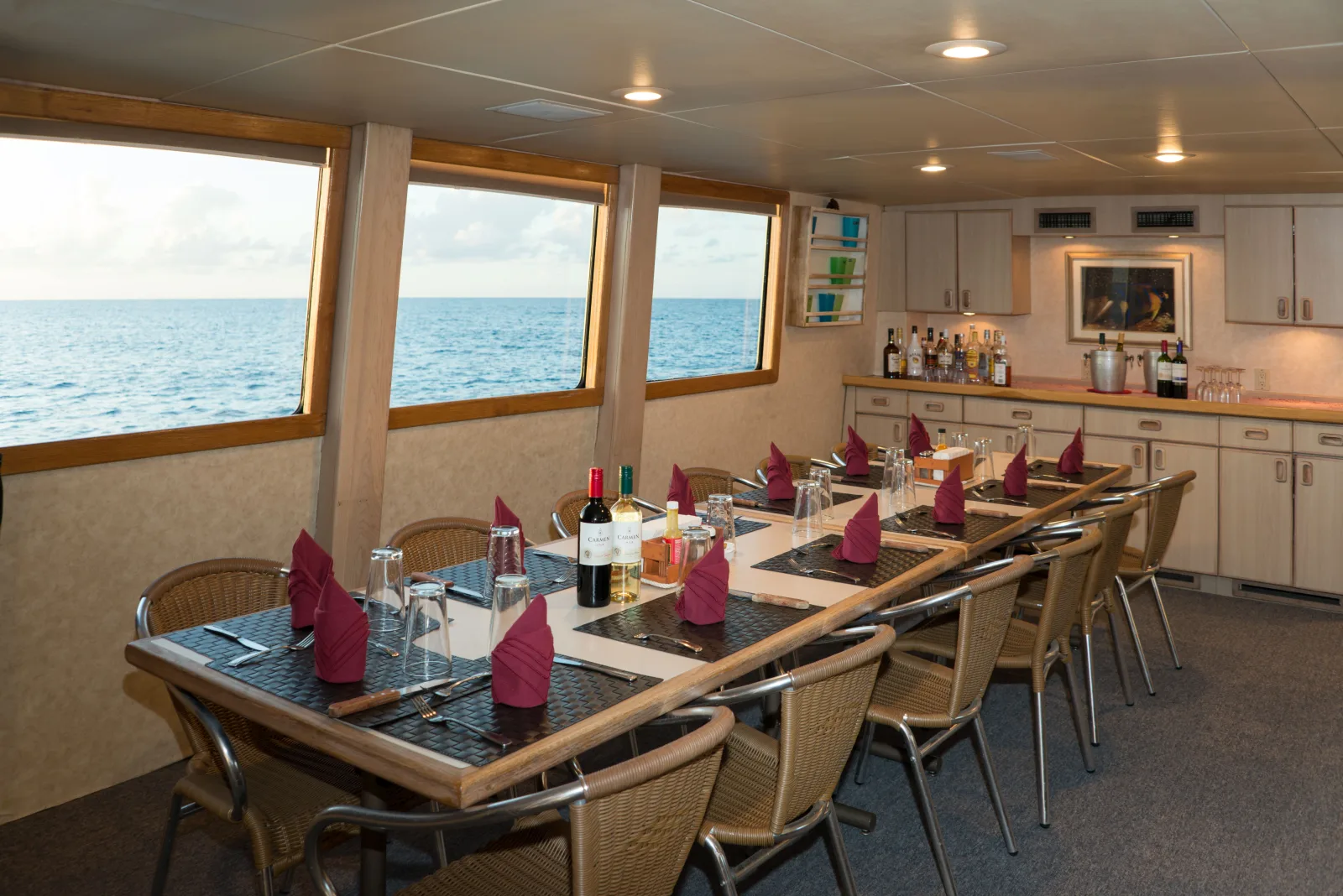 Salon of Turks & Caicos Explorer II — laid table and panoramic windows