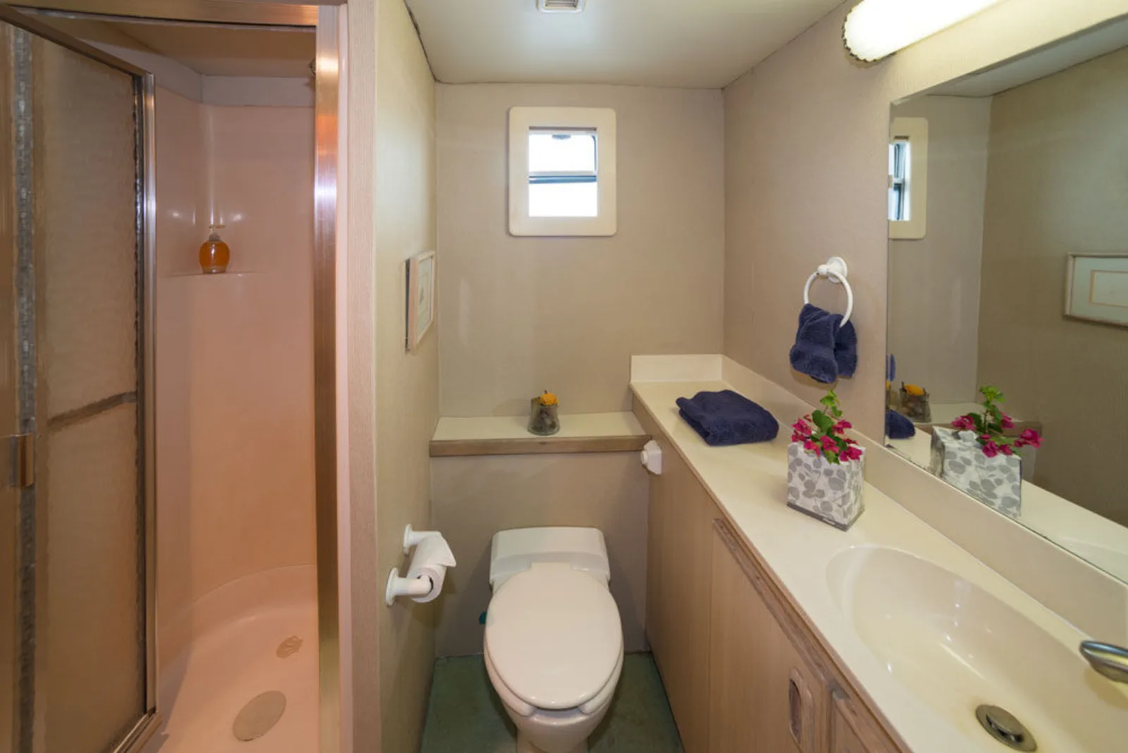 VIP stateroom ensuite on Turks & Caicos Explorer II — shower stall and vanity