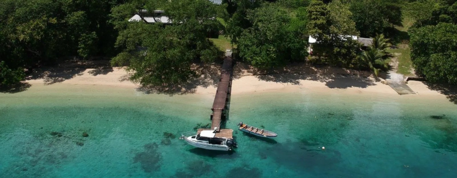 The beach and the jetty the boat leaves from