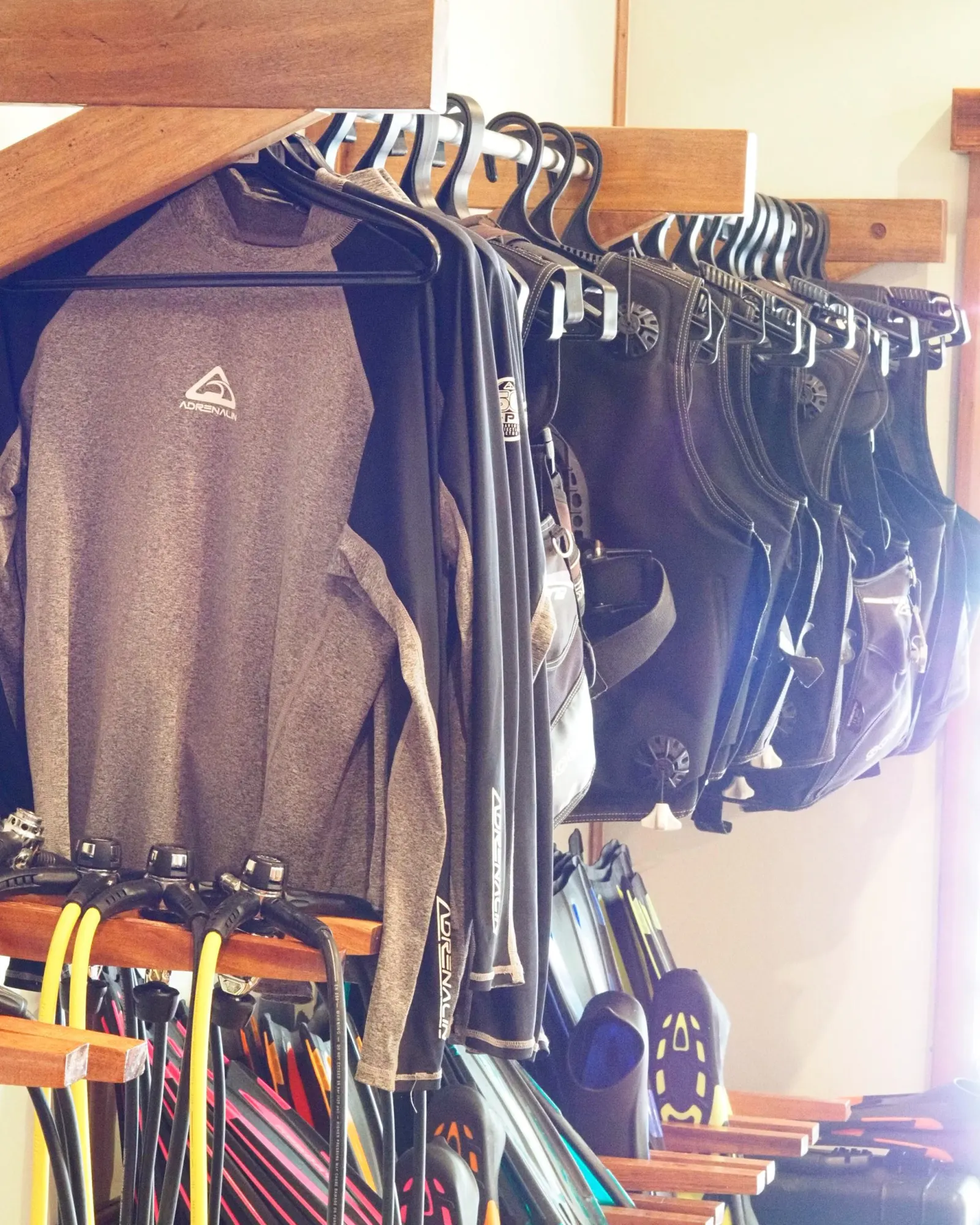 Wetsuits on the rack