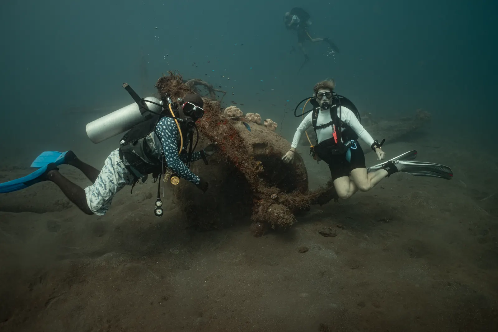 Divers over wreckage on the bottom