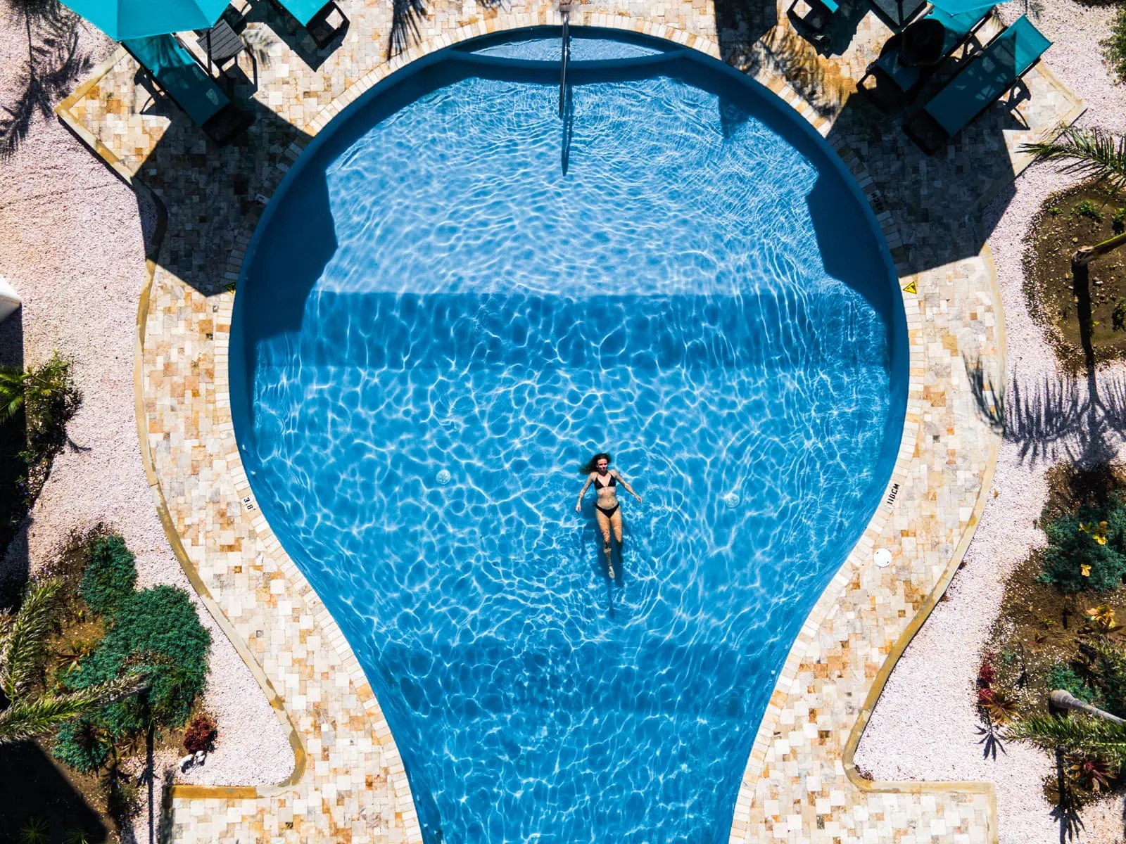 The pool and a swimmer from the air