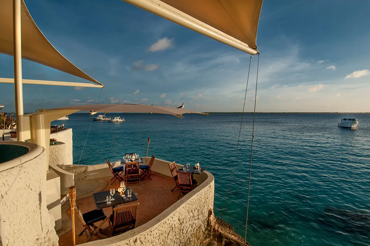 A table over the water at sunset