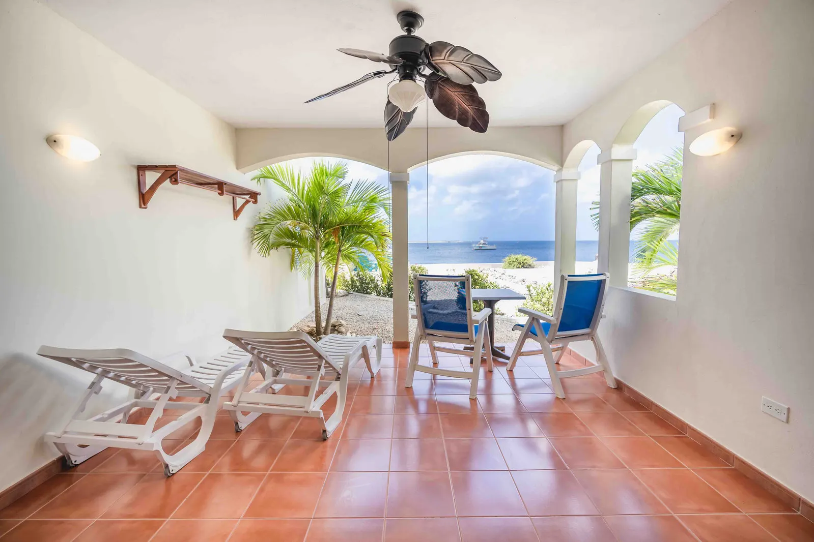 A veranda with sun loungers