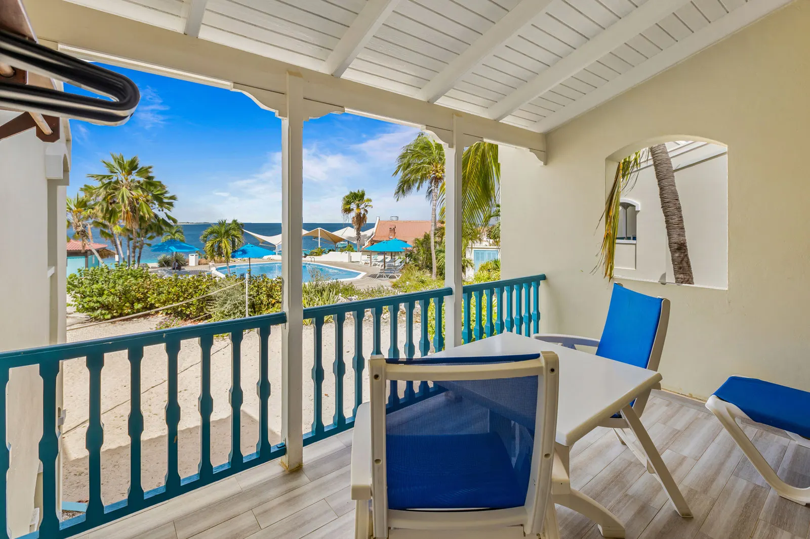 A covered veranda looking over the water