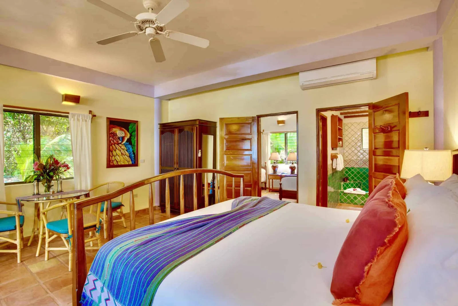 Room with a bed and a door into the adjoining bedroom