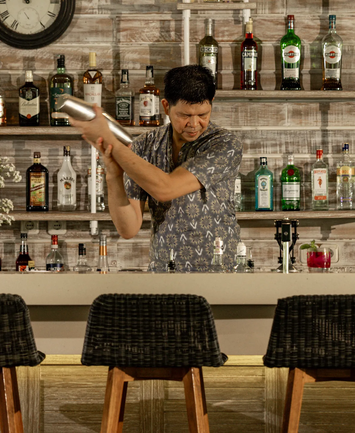 Bartender mixing a cocktail at the resort bar