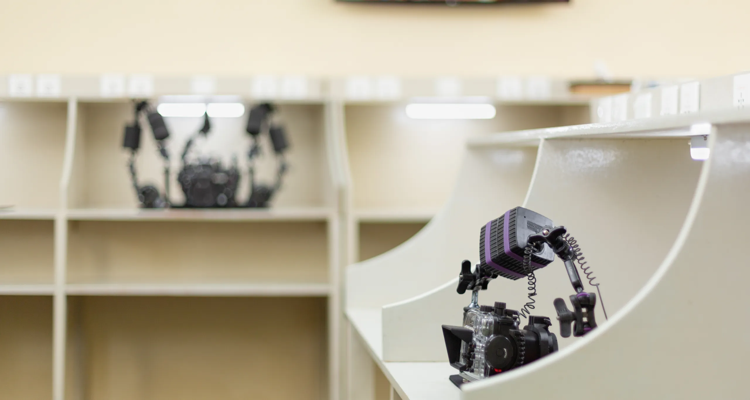 Housed camera on a workstation in the photo centre