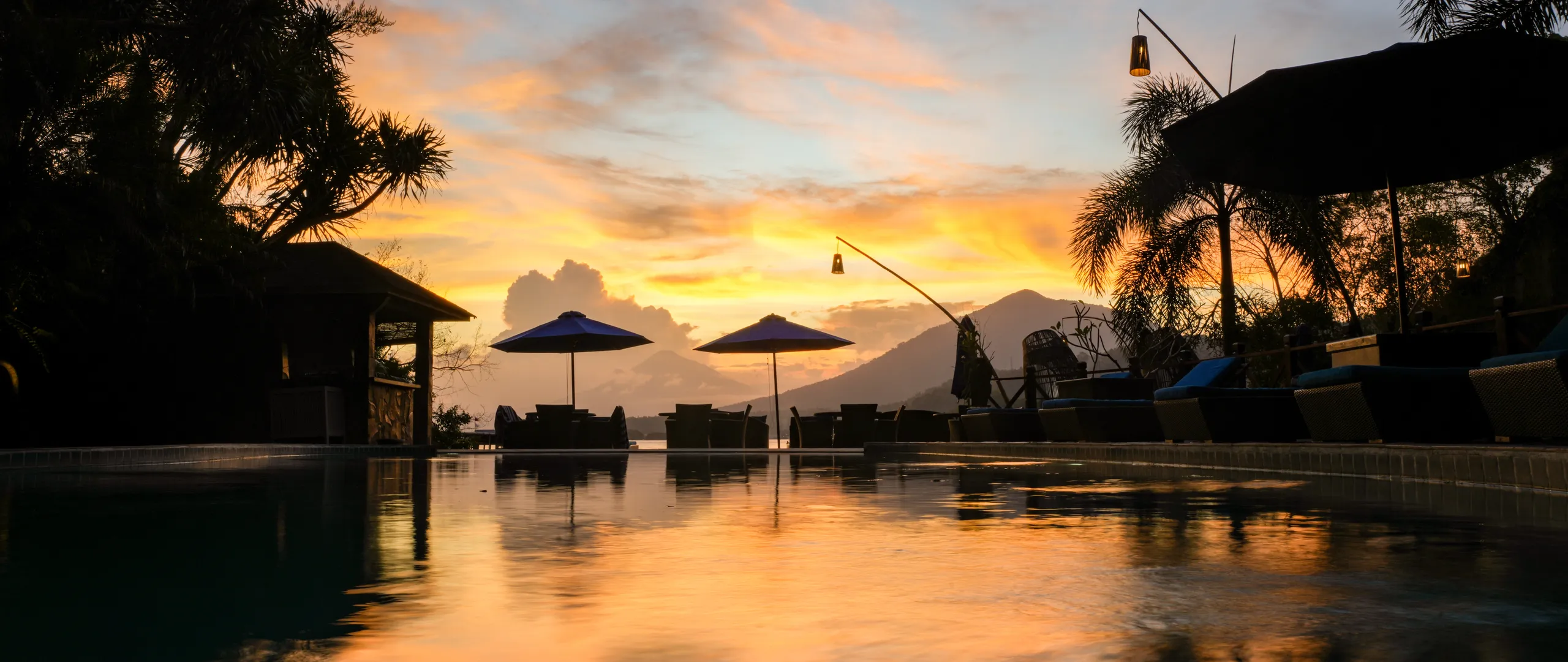 Sunset over the resort pool in the Lembeh Strait