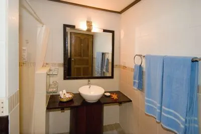 Bungalow bathroom with a basin and mirror