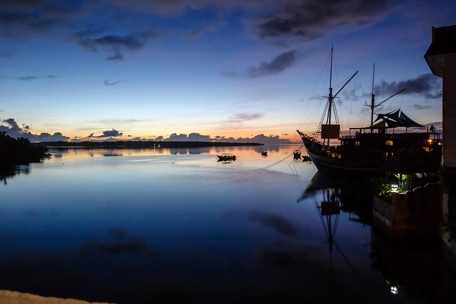 Colonia bay and the schooner at sunset