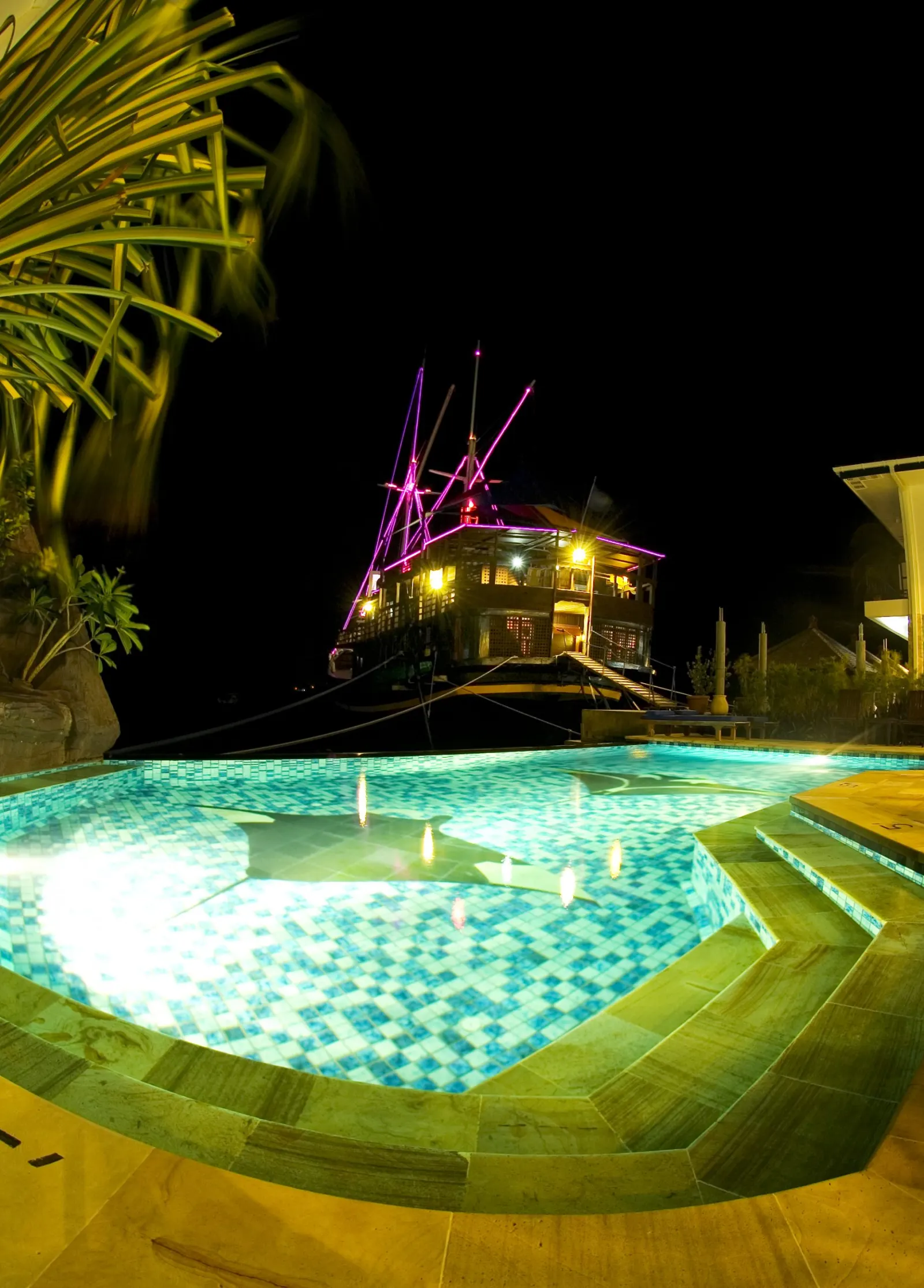 The pool and the schooner at night