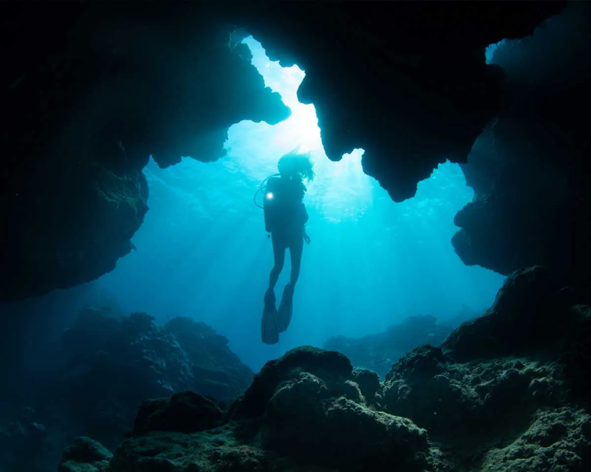 A diver in a cavern passage