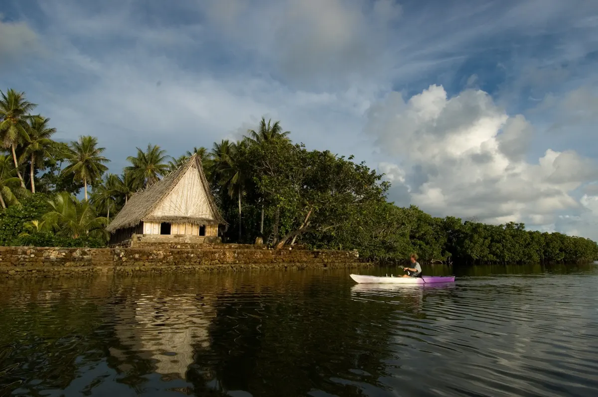 A men's house on the lagoon shore
