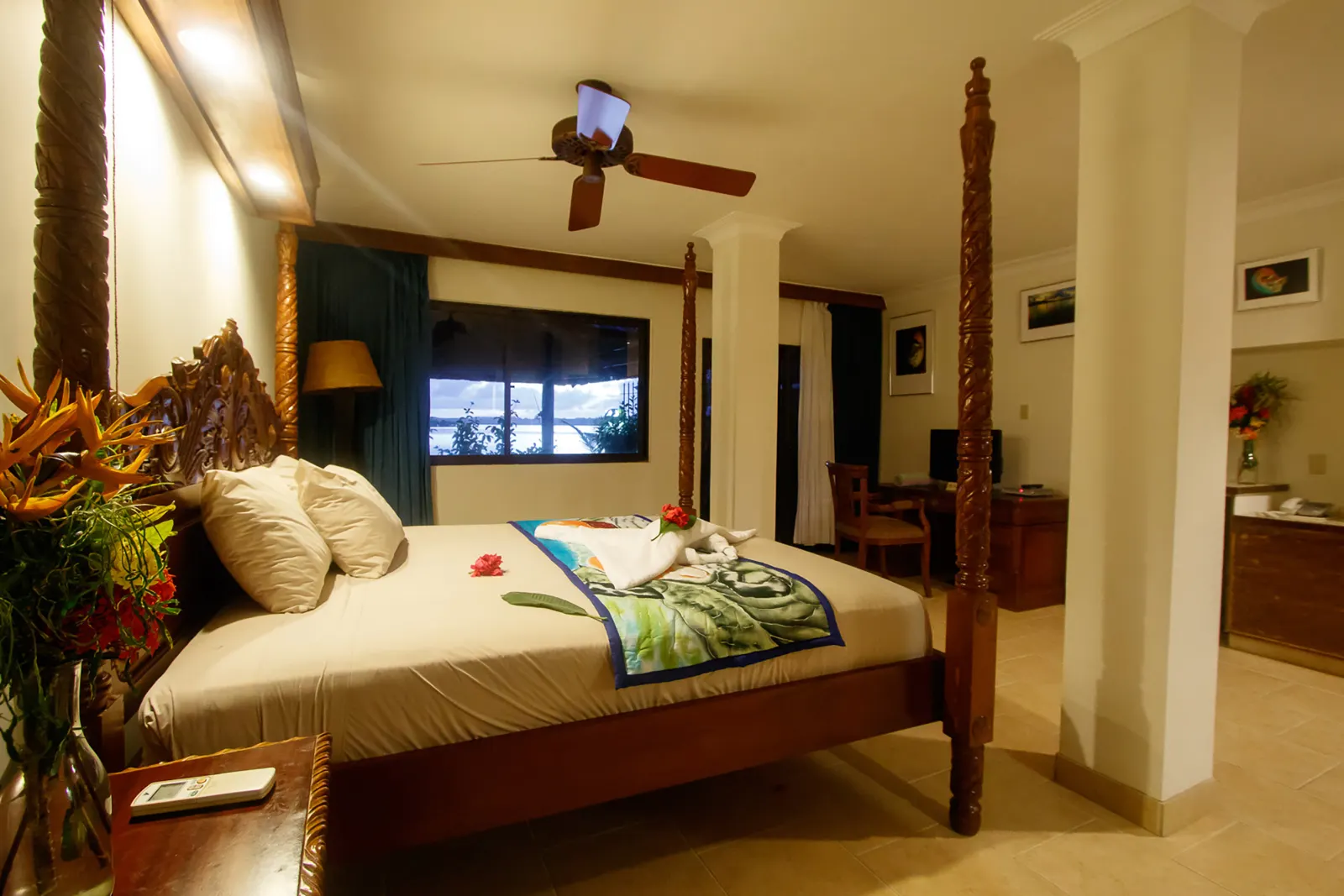 Deluxe Ocean View — carved four-poster king bed