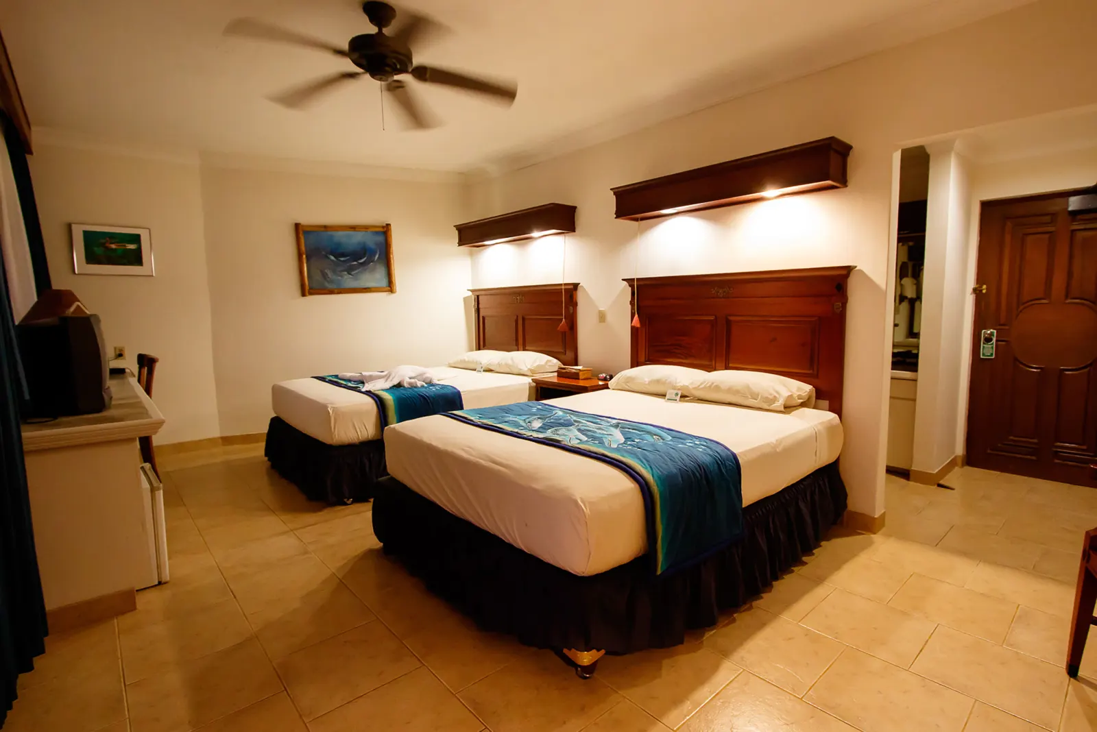 Ocean View Room — bed and window onto the bay