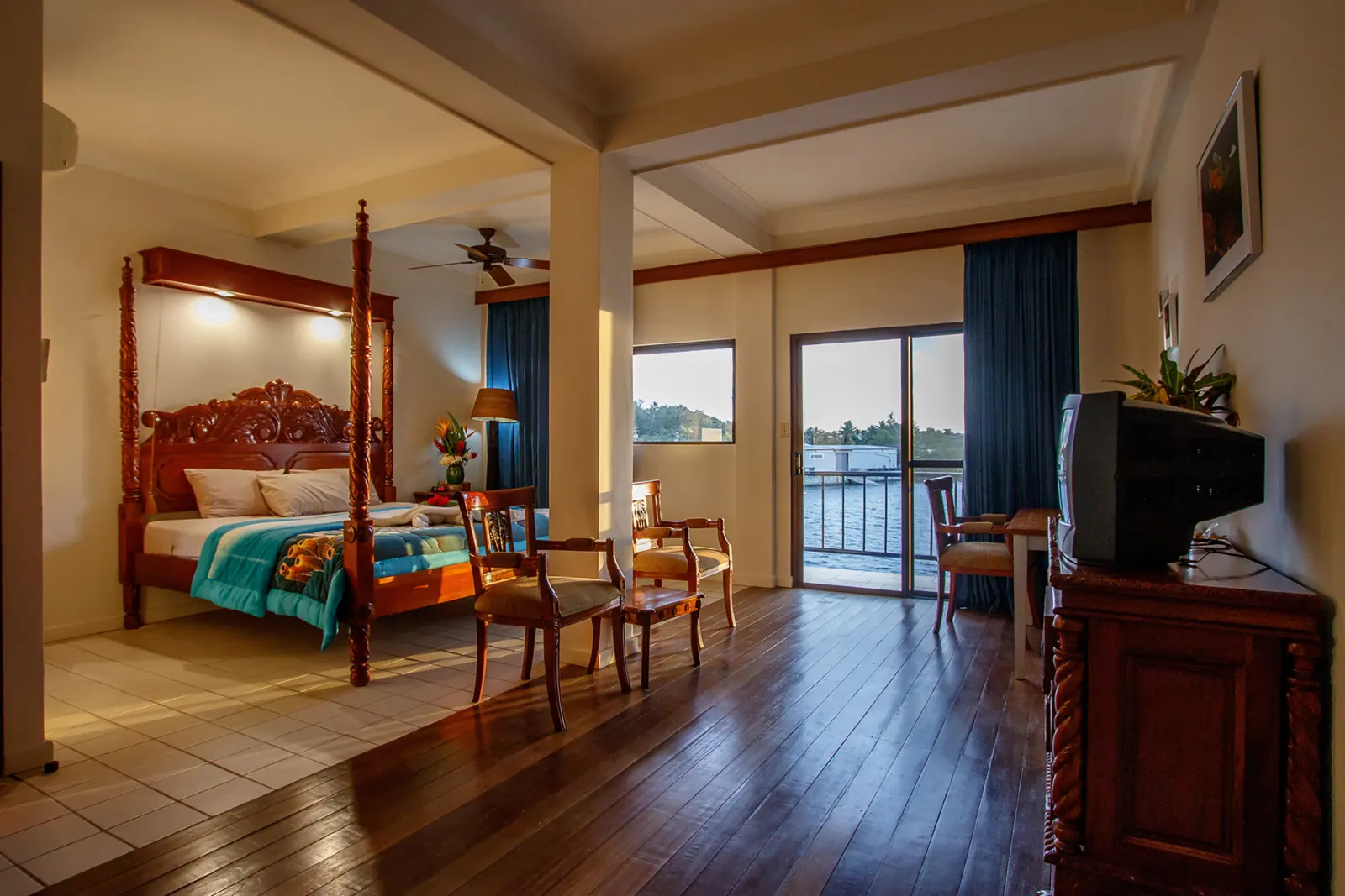 Ocean View Room — four-poster bed and a view of the water