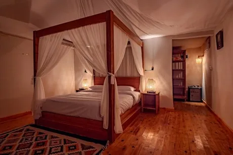 Bed in the tent with a sea view