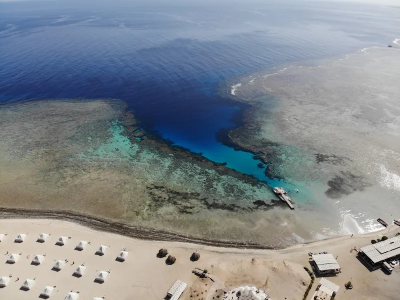 Marsa Shagra bay and its house reef from the air