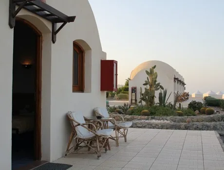 Domed huts along the shore