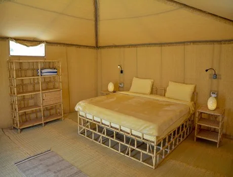 A royal tent with chairs outside