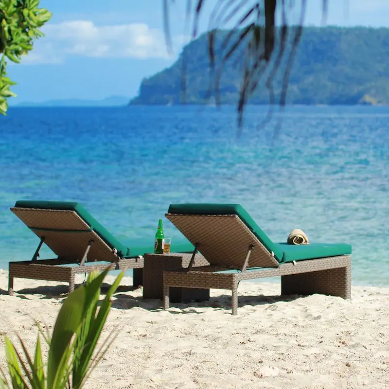 Sun loungers on white sand
