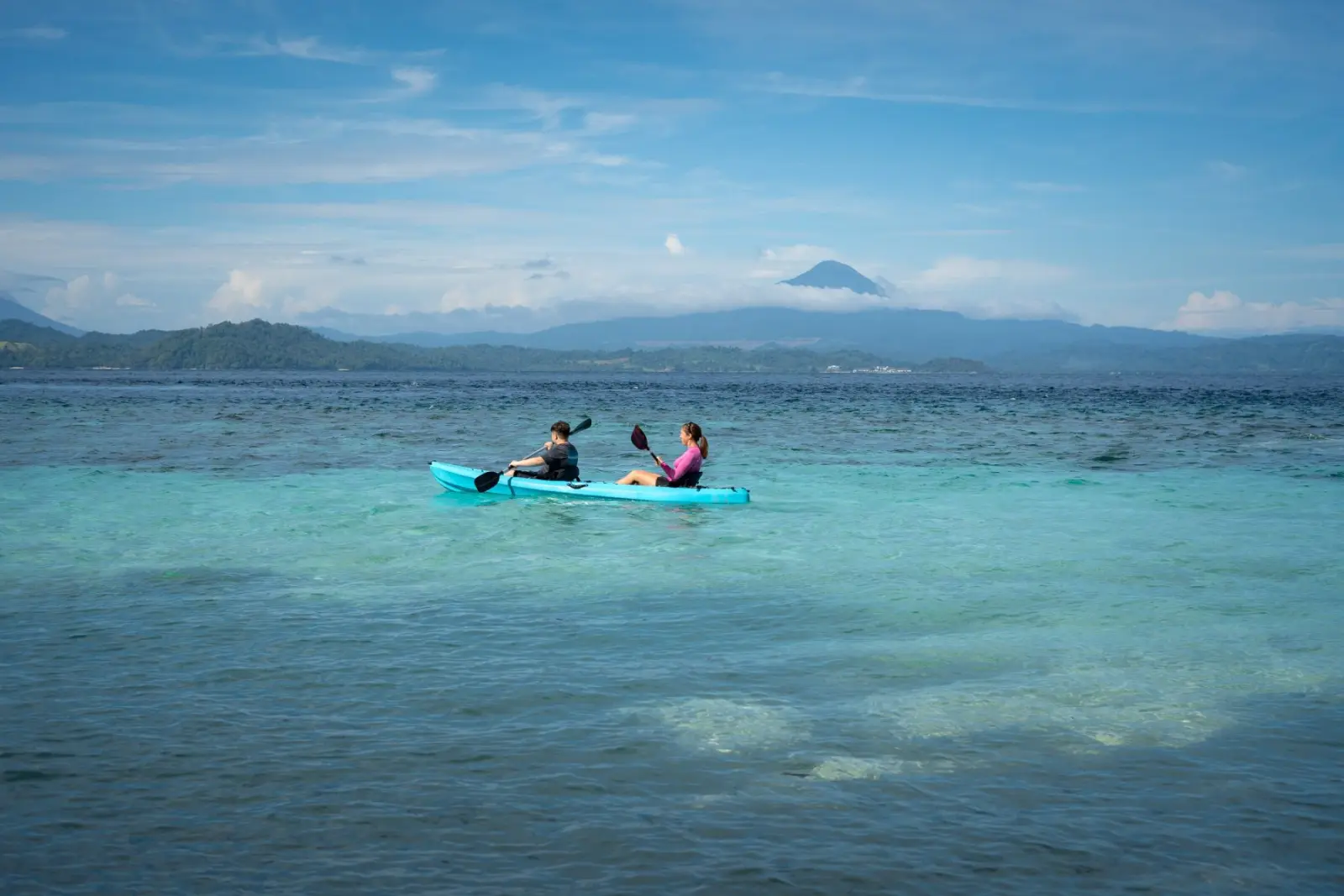 Kayaks in turquoise water