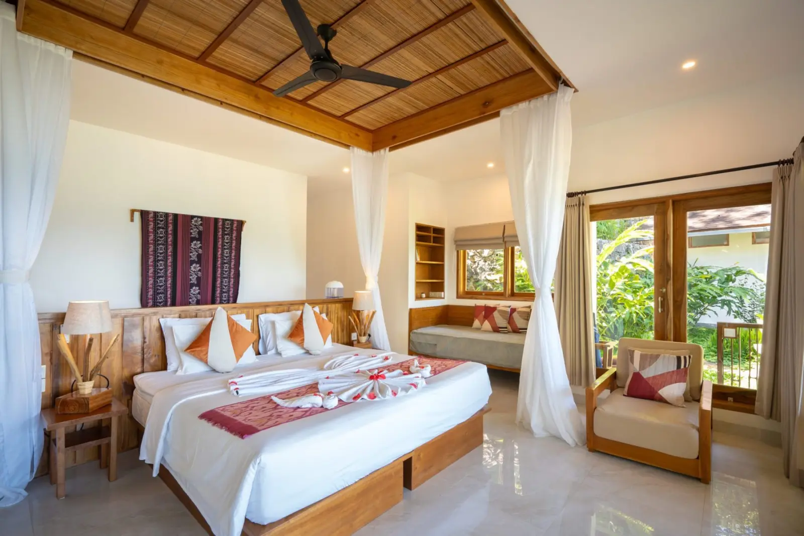 Bedroom with mosquito nets and an ocean view