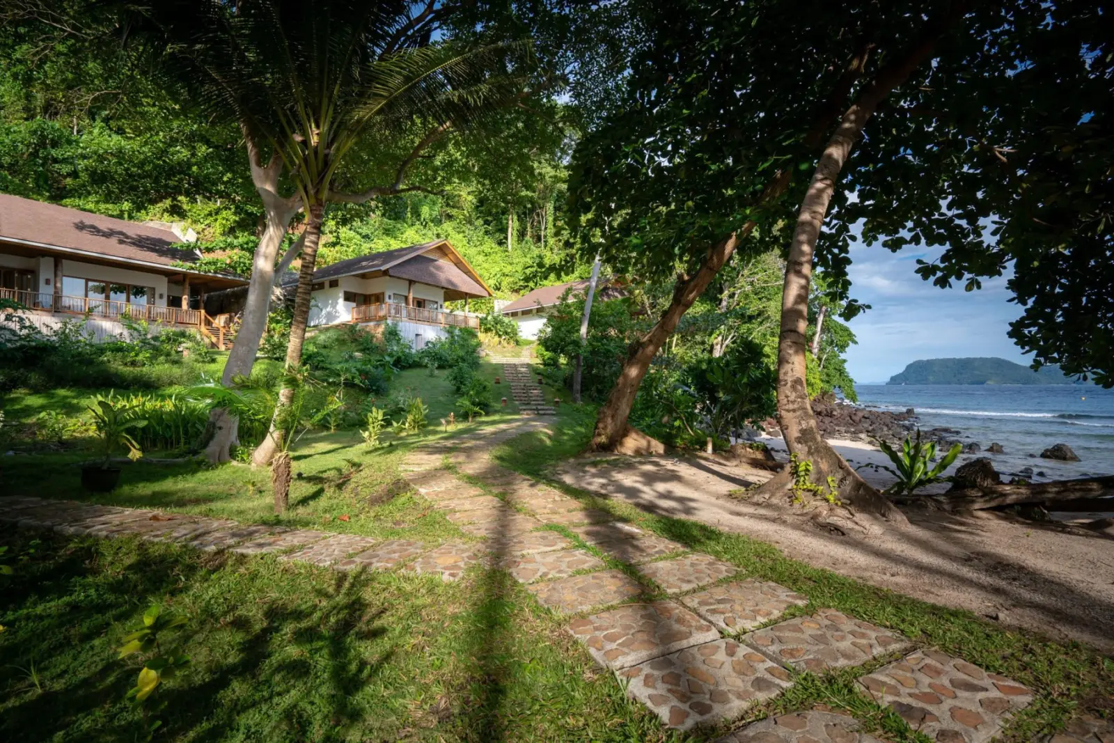 Cottage among the trees by the beach