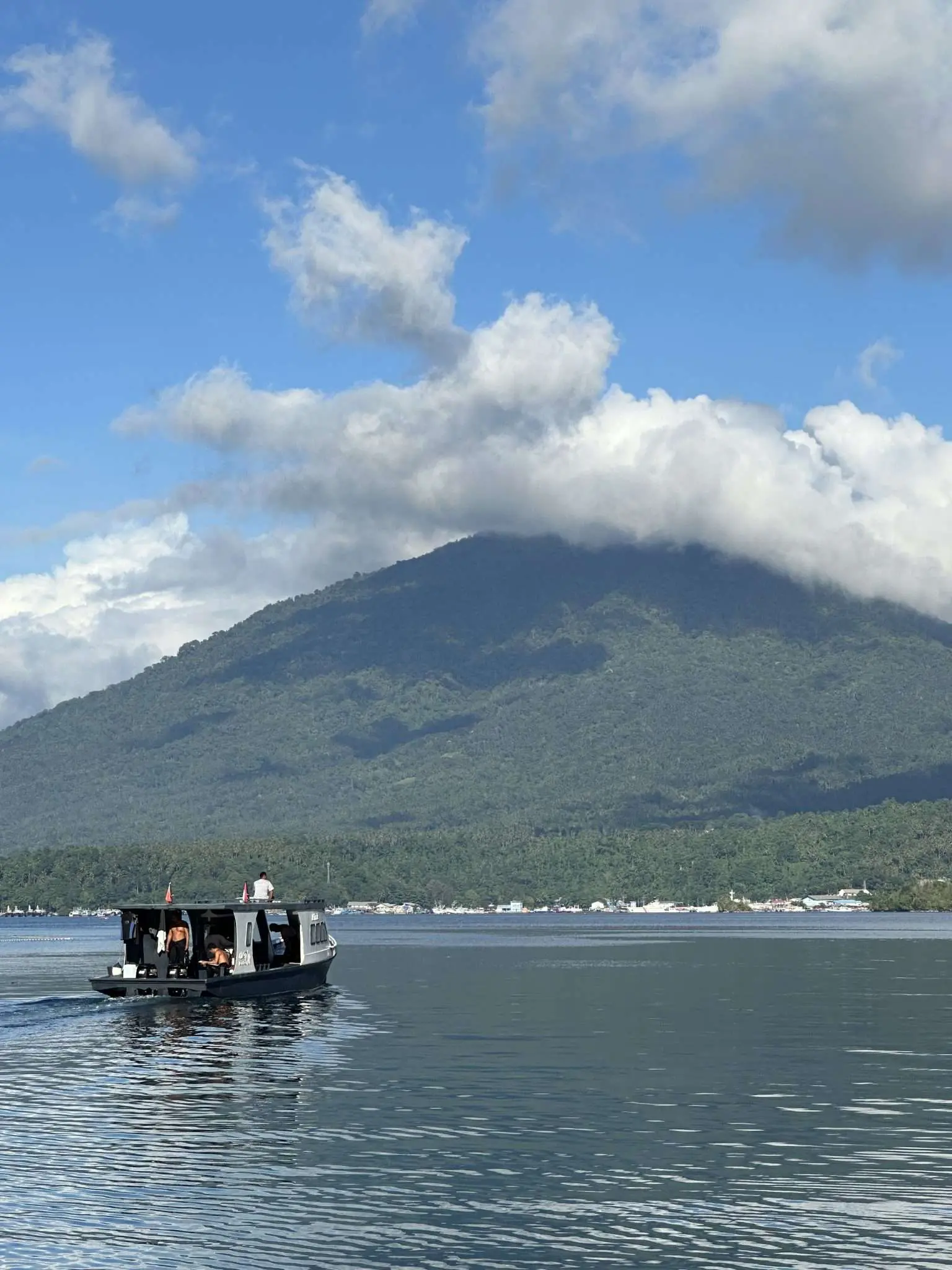 A boat with the volcano behind