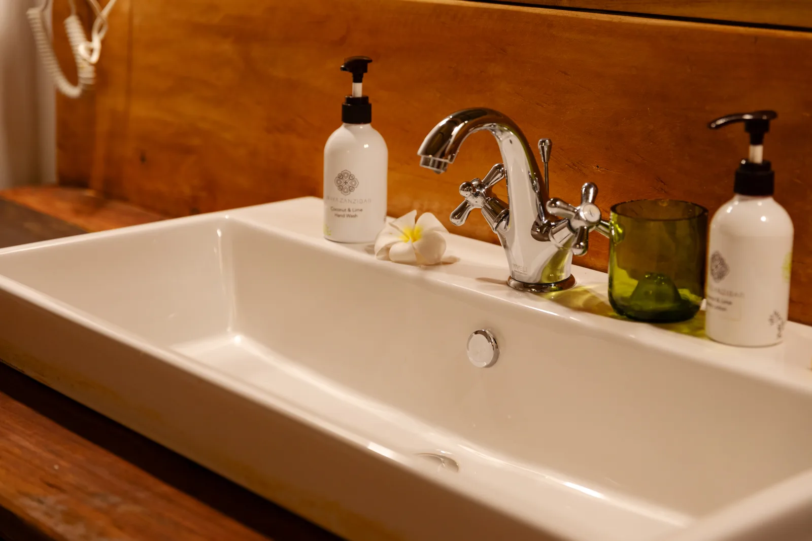 Suite bathroom with a wide basin and Inaya toiletries