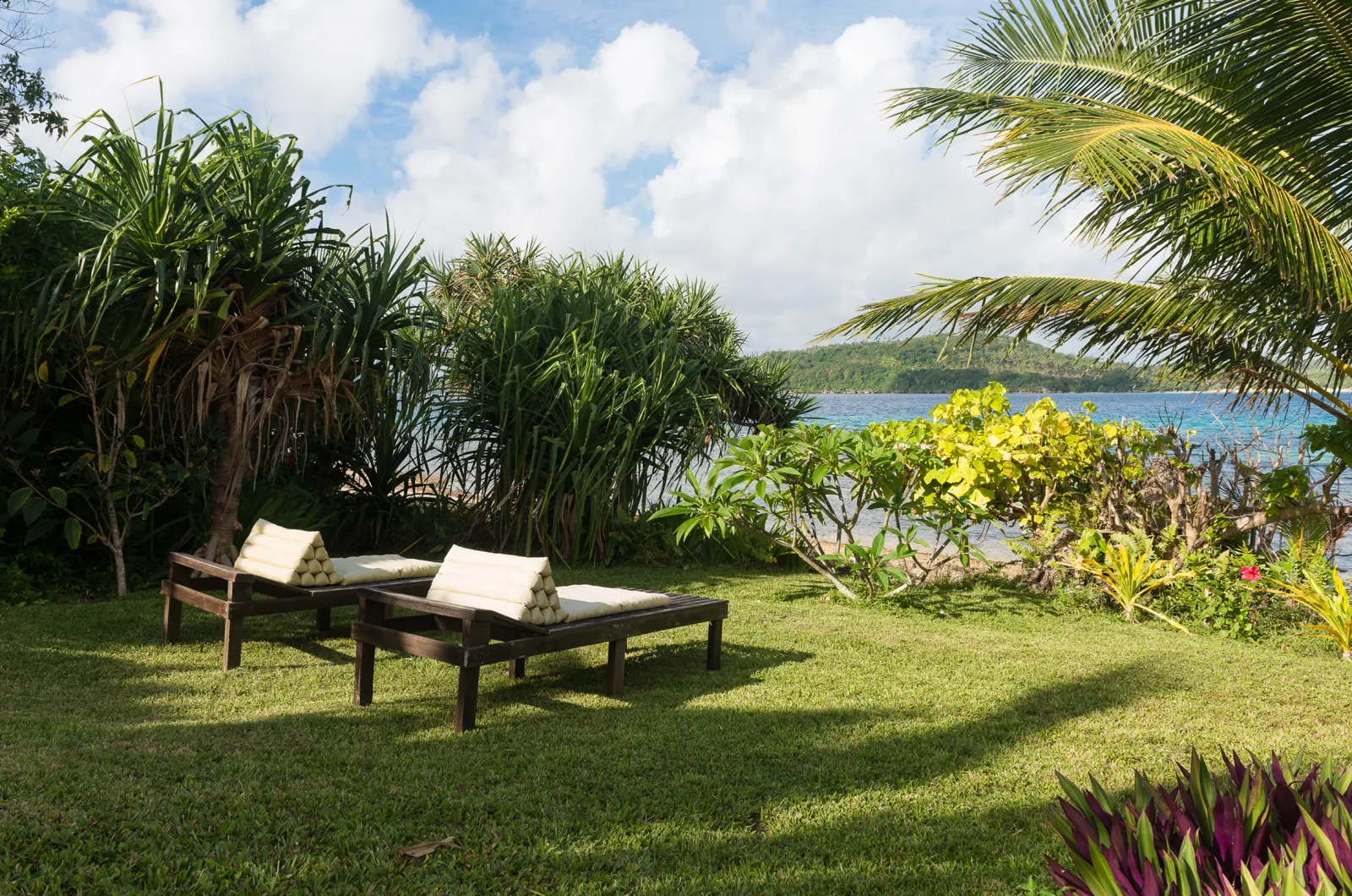Sun loungers on the lawn above the lagoon