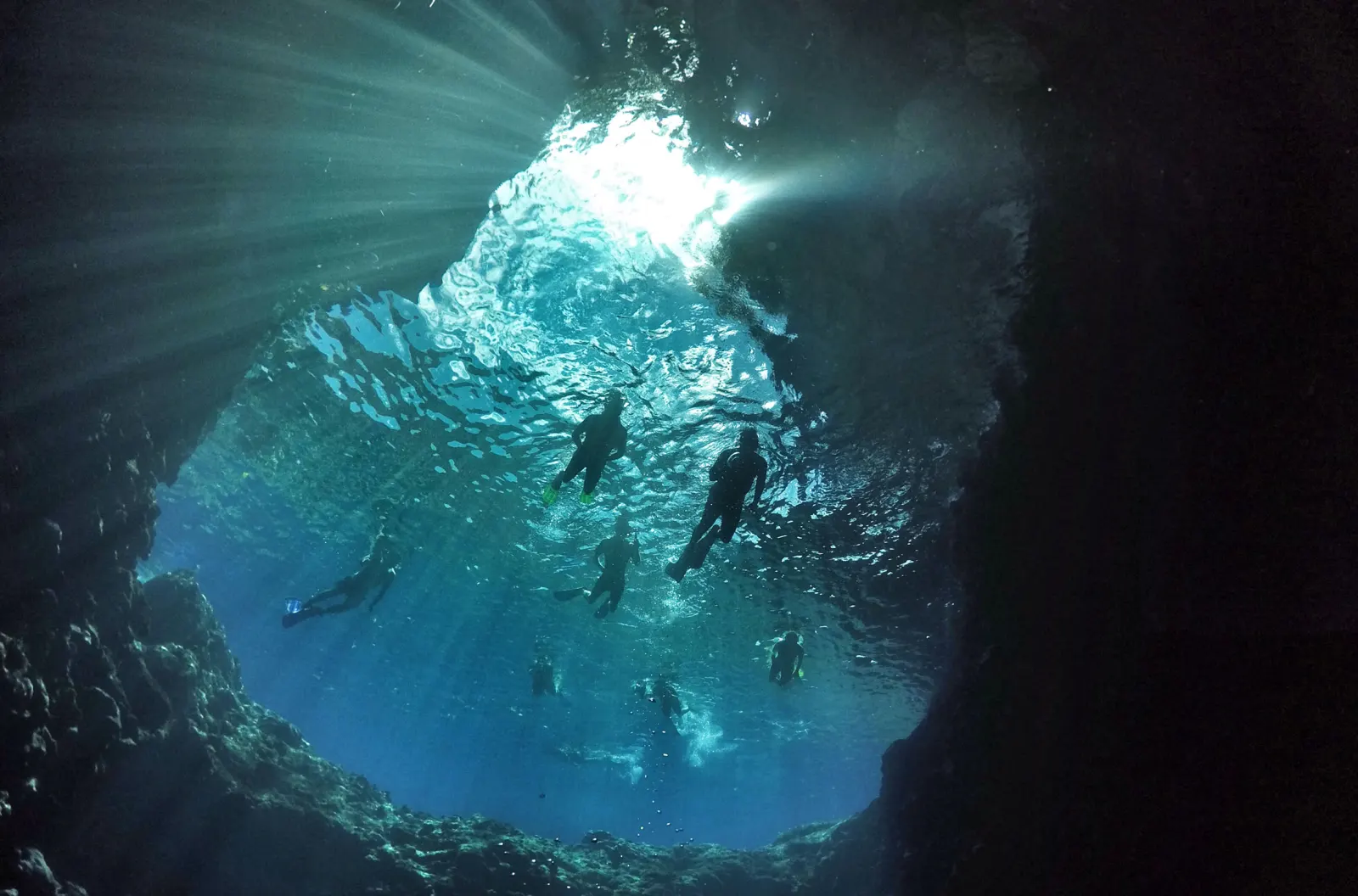Shafts of light in an underwater cave