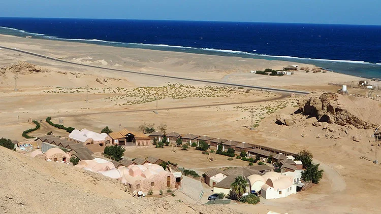 The lodge between desert and sea from above