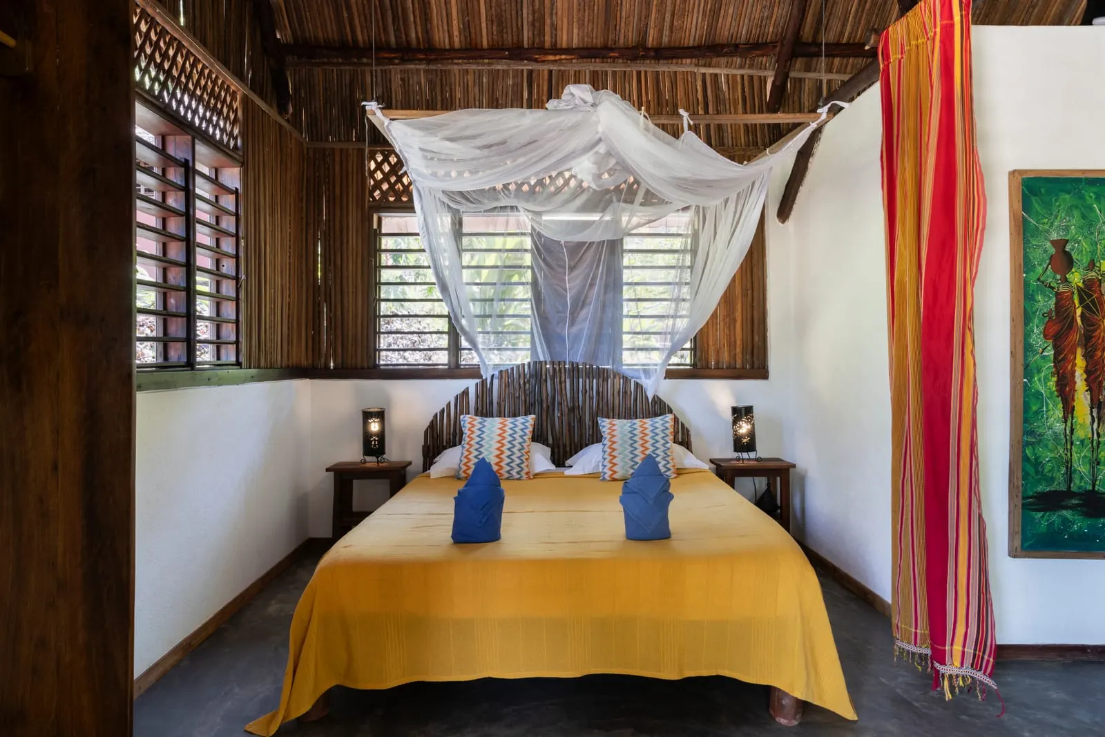 Double bed under a mosquito net