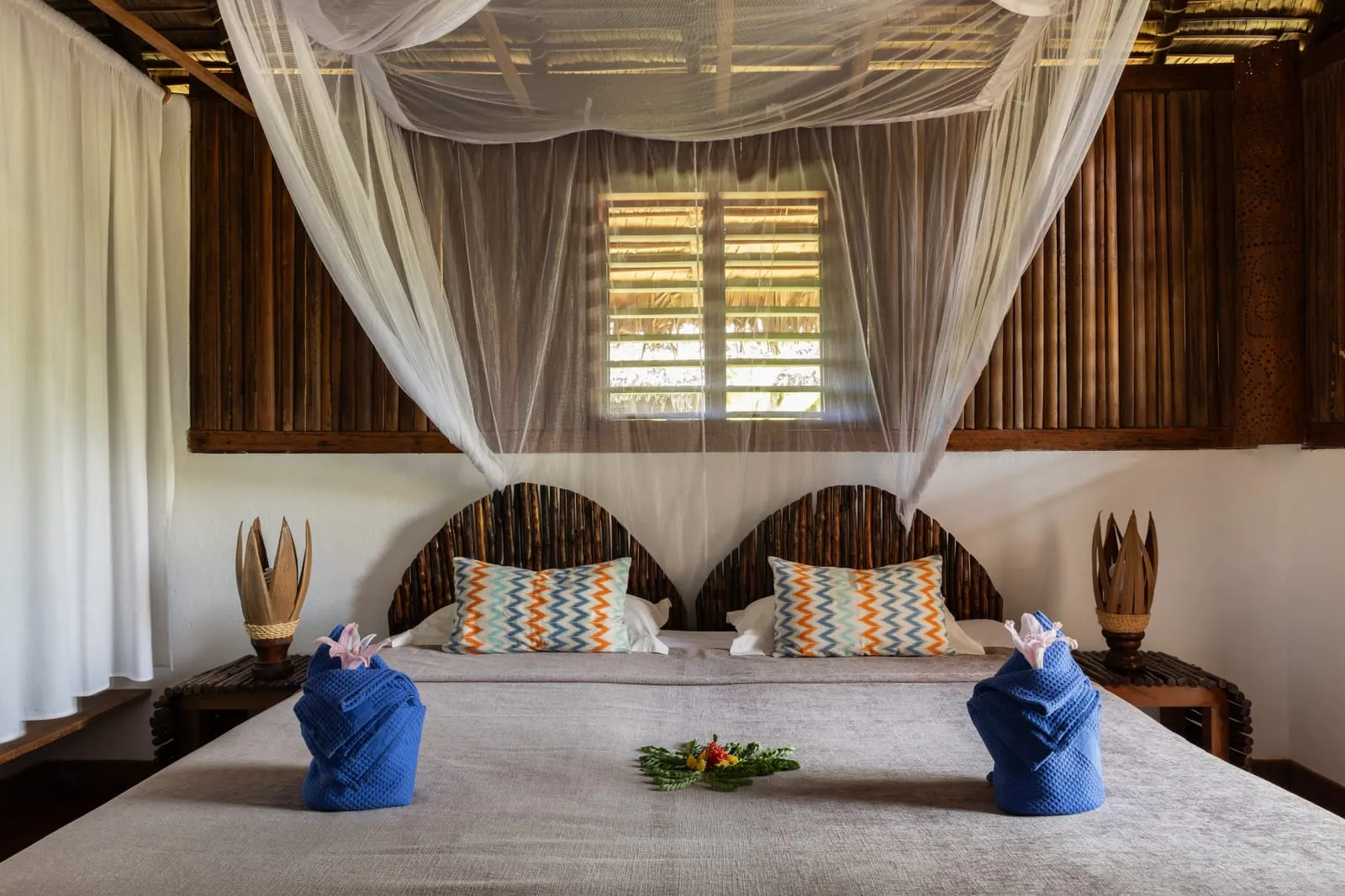 Two single beds under a net