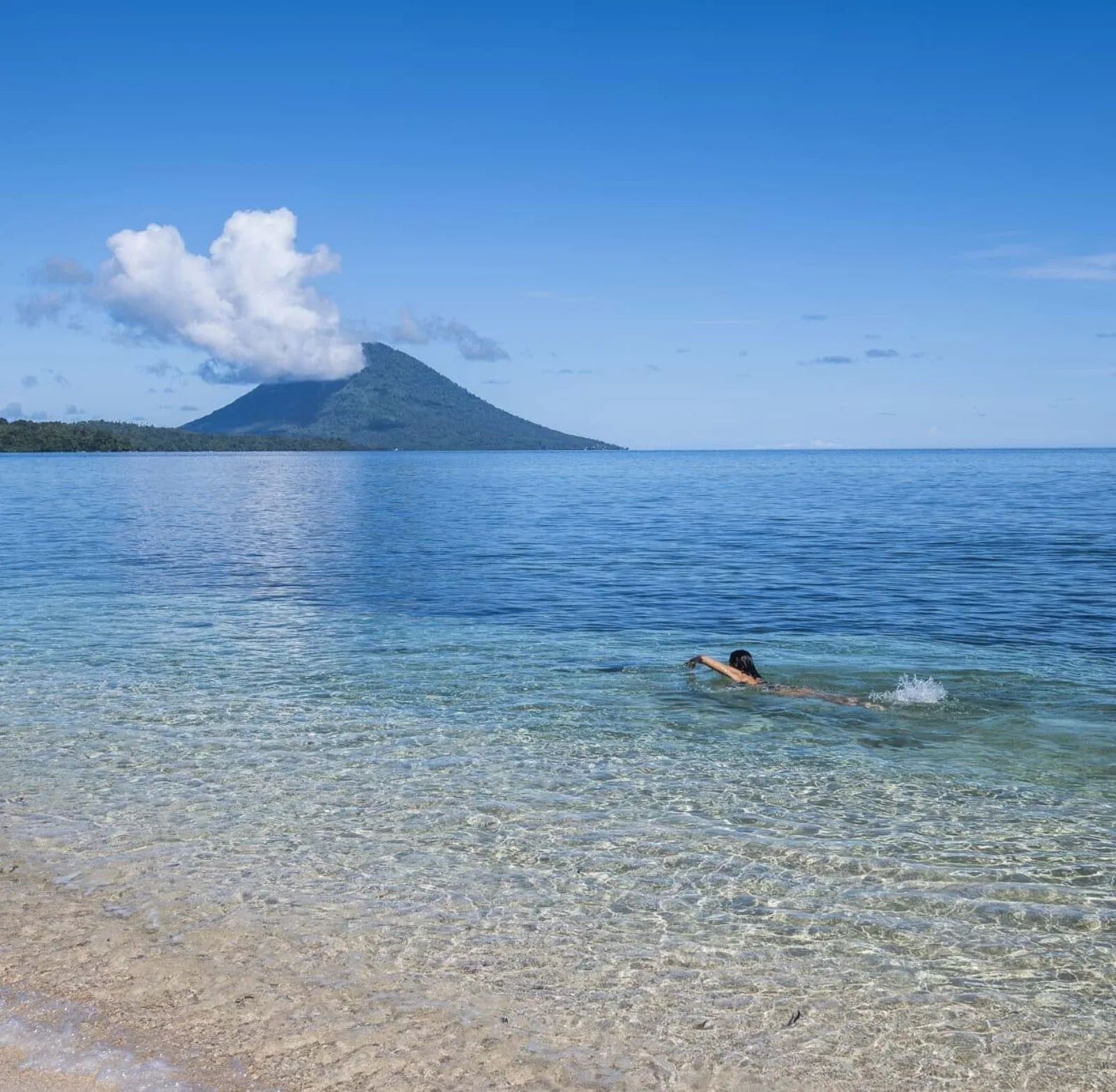 The Manado Tua volcano across the sea from Siladen